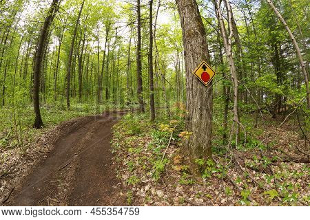 A Stop Sign Posted On Tree On Atv And Dirtbike Multi-use Or Multipurpose Trail In Simcoe County