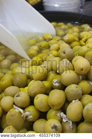 Pickled Olives Stuffed With Vinegar Pickled Anchovies. Delicious Pickled Snack Displayed Plastic Bas