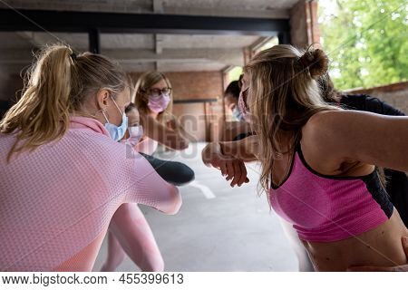Group Or Team Of Happy Young Sportive Women In A Gym All Cheering With Elbows And Applauding, All We