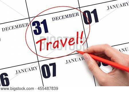 31st Day Of December. Hand Drawing A Red Circle And Writing The Text Travel On The Calendar Date 31 