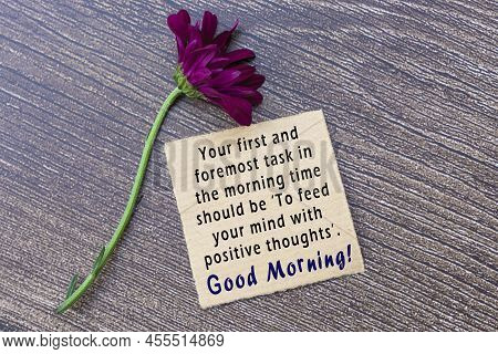 Motivational On Brown Note On Wooden Surface - Your First And Foremost Task In The Morning Time Shou