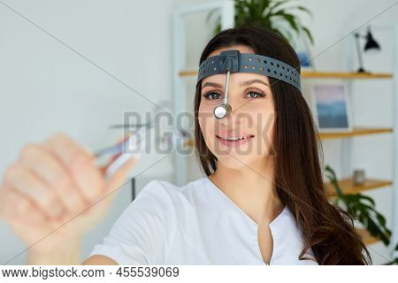 Instruments Ent Doctor Close-up With Hand. Therapist. Female Ent Doctor Holding A Tool. Nasal Specul