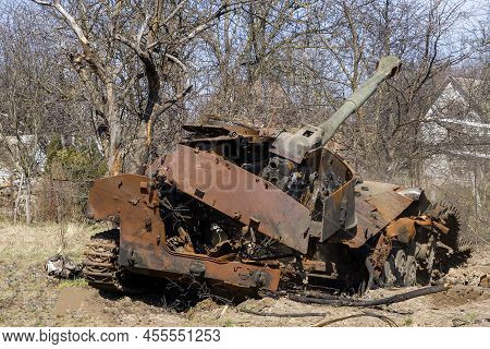 Burnt Tank, Armored Personnel Carrier, City Of Ukraine. Destroyed Cities. Demilitarization Of Russia
