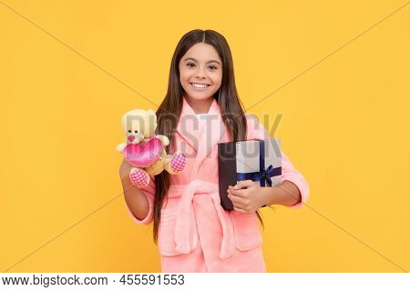 Good Morning. Kid Wear Soft Nightsuit Play With Toy. Child In Cozy Sleepwear. Skin Beauty.