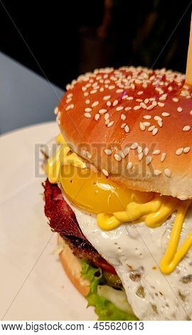 Juicy Delicious Burger With Spices In A Caffe