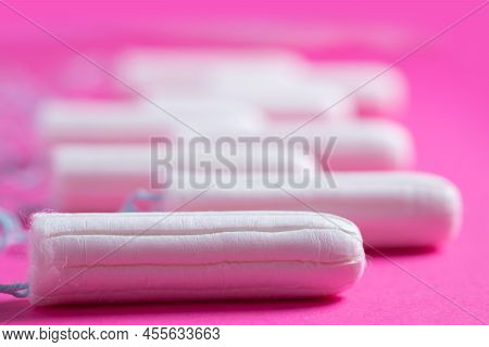 Medical Female Tampon Close Up On A Pink Background. Hygienic White Tampon For Women. Cotton Swab. M