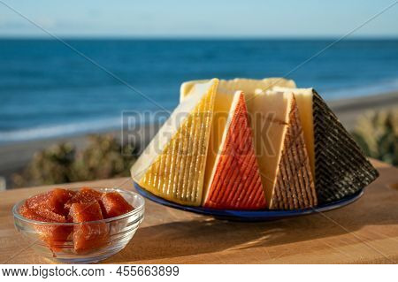 Assortment Of Spanish Hard Cheeses, Curado, Manchego, Goat Cheese Served Outdoor With Membrillo Jam