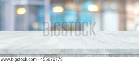 Empty White Table Top, Counter, Desk Over Blur Perspective Store With Bokeh Light Background, White 