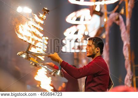 17.12.2019, Varanasi, India. Sacred Religious Ceremony Arati In The Temple. A Group Of People Burn I