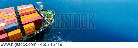 Aerial Side View Of Cargo Ship Carrying Container And Running For Export  Goods  From  Cargo Yard Po