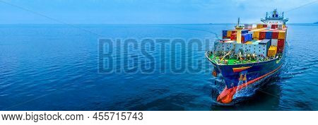 Aerial In Front View Of Cargo Ship Carrying Container And Running For Export  Goods  From  Cargo Yar