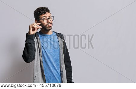 Person Showing A Small Amount With His Fingers, People Gesturing With His Hand Showing Something Sma