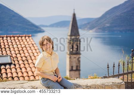 Boy Tourist Enjoying Colorful Street In Old Town Of Perast On A Sunny Day, Montenegro. Travel To Mon