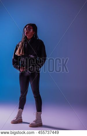 Full Length Of Trendy African Amercan Woman In Smart Glasses On Blue And Purple Background.
