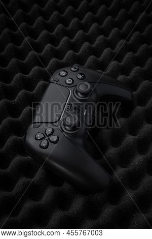 May 27, 2022, Odessa, Ukraine. Black Gamepad Sony Playstation 5 On A Dark Foam Background. Dualsense