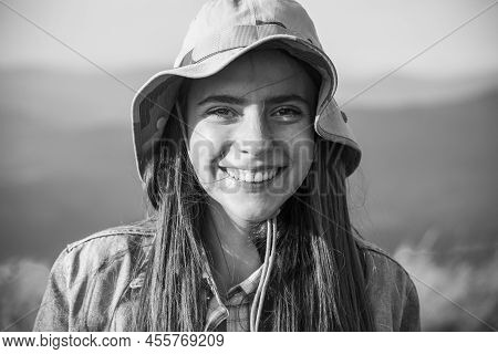 Portrait Of Beautiful Woman Smiling And Looking Away At Park During Nuture. Outdoor Portrait Of A Sm
