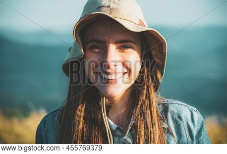 Portrait Of Beautiful Woman Smiling And Looking Away At Park During Nuture. Outdoor Portrait Of A Sm