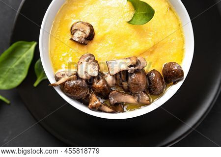A Closeup Shot Of Cooking Polenta. Polenta Is A Traditional Northern Italian Dish Made From Coarse C