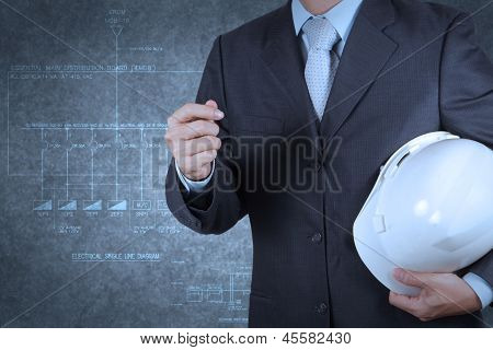 Engineer With An Electronic Single Line And Fire Alarm Riser Schematic