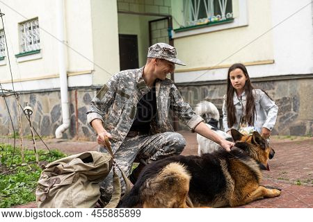 Military Father Meeting With Daughter And Dogs