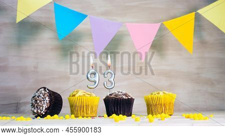 Birthday Background With Number 93. Beautiful Birthday Card With Colorful Garlands, A Muffin With A 