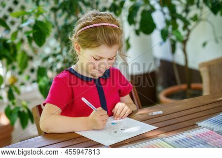 Happy Preschool Girl Learning Painting With Colorful Pencils And Felt Pens. Little Toddler Drawing A