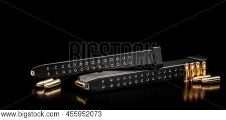 Pistol Cartridges 9 Mm On A Smooth Glossy Surface With Reflections. Ammunition For Pistols And Pcc C