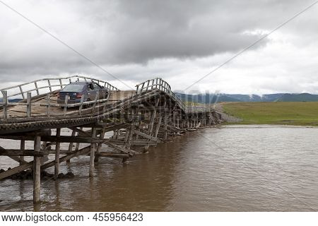 Orkhon Valley, Mongolia - August 02 2018: Hazardous Wooden Bridge Crossing The Orkhon River In The O