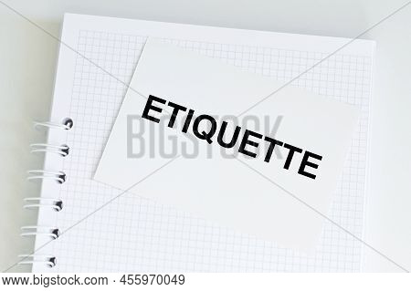 A White Business Card With Etiquette Text