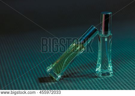 Perfume Bottle On The Table, Black Background
