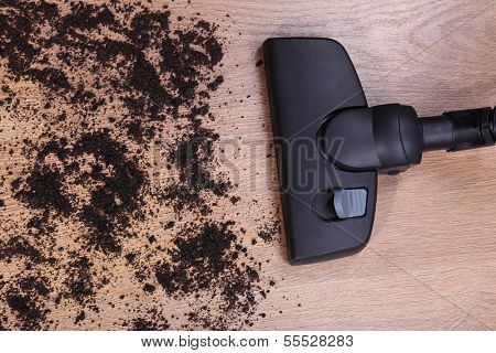 Vacuuming floor in house