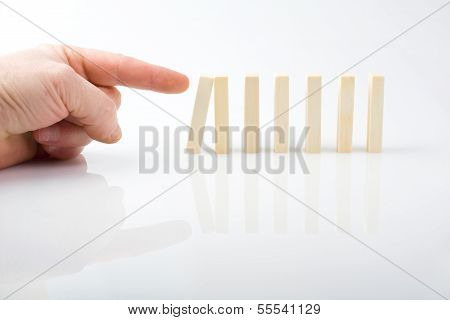 Hand And Falling Pieces On White Background