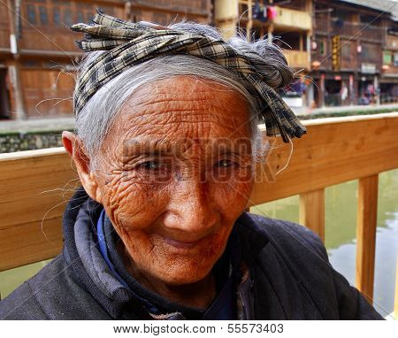 Asian Elderly Woman From The Countryside Of China, Close-up Portrait.