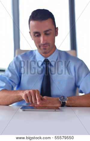 close-up of human hand  business man using tablet compuer at office