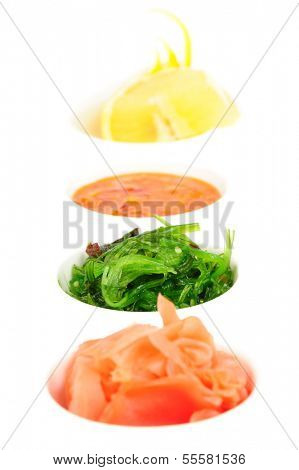 Pickled ginger, chuka sea weed, hot sauce and lemon. Focus on chuka.