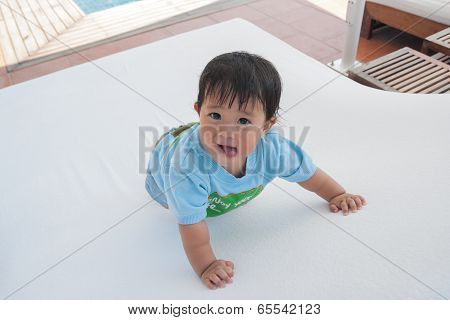 Happy Time On Pool Bed Beside On The Tropical Resort Swimming Pool
