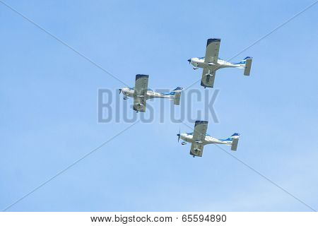 BERLIN, GERMANY - MAY 21, 2014: Aerobatic team 3x Fly Sinthesis Texan Top Class (Wefly team, Italy) performance during the International aviation and space exhibition ILA-2014.