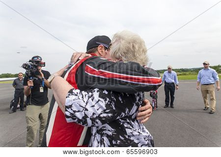Concord, NC - May 25, 2014:  NASCAR driver, Kurt Busch (26), embraces his family after completing the Indianapolis 500 IndyCar race and landing at Concord Regional Airport in Concord, NC.