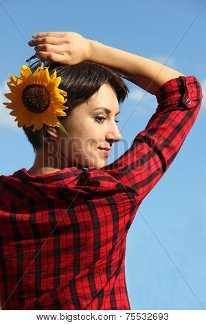 Young woman with a sunflower