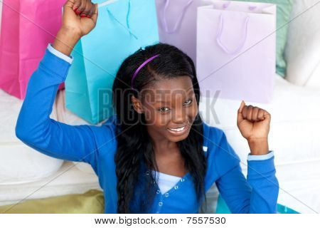 Joyful Woman Punching The Air In Celebration After Shopping