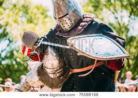Knights In Fight With Sword. Restoration Of Knightly Battle