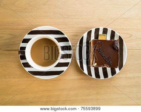 A cup of coffee and cake.