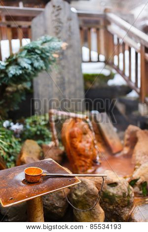 Water dipper at outdoor public hot spring spa area at Shibu Onsen, Nagano Japan