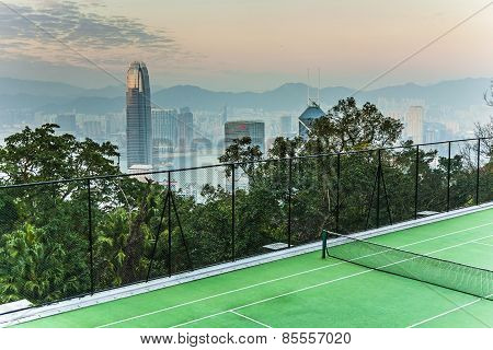 Top Of Skyscraper By Night With Panorama Of Hong Kong And Tennic Courts