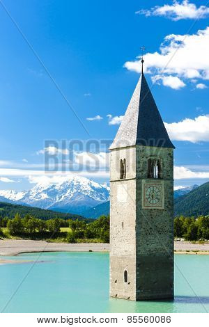 tower of sunken church in Resia lake, South Tyrol, Italy