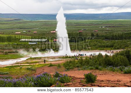 Tourists Are Looking Eruption Of Strokkur Geyser, Iceland