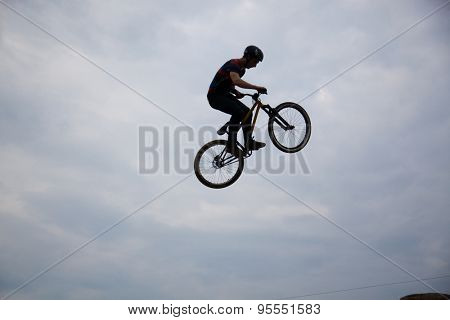 BONTIDA, ROMANIA - JUNE 27, 2015: Unidentified BMX rider making a bike jump during the BMX Competition, at Electric Castle Festival.