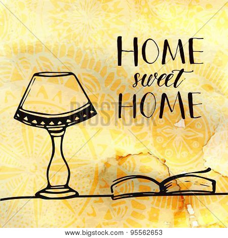 Lamp and book on the table and calligraphy text Home sweet home. Hand drawn doodles at coffee textur