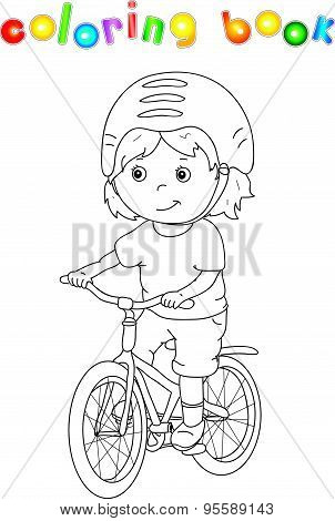 Young Boy Riding A Bicycle In Helmet