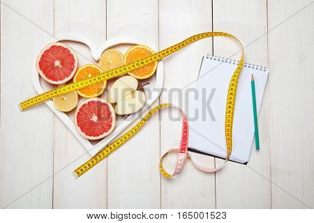 diet plan and centimeter on a white background